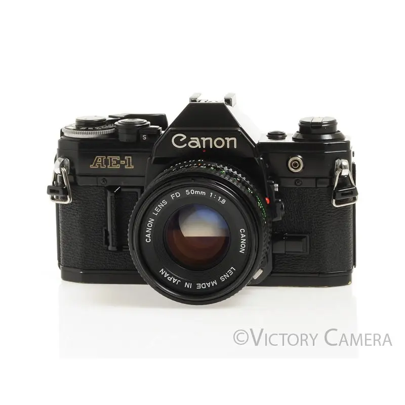 Canon AE-1 35mm Black Film Camera with 50mm f1.8 Lens -New Seals- [EXC-]
